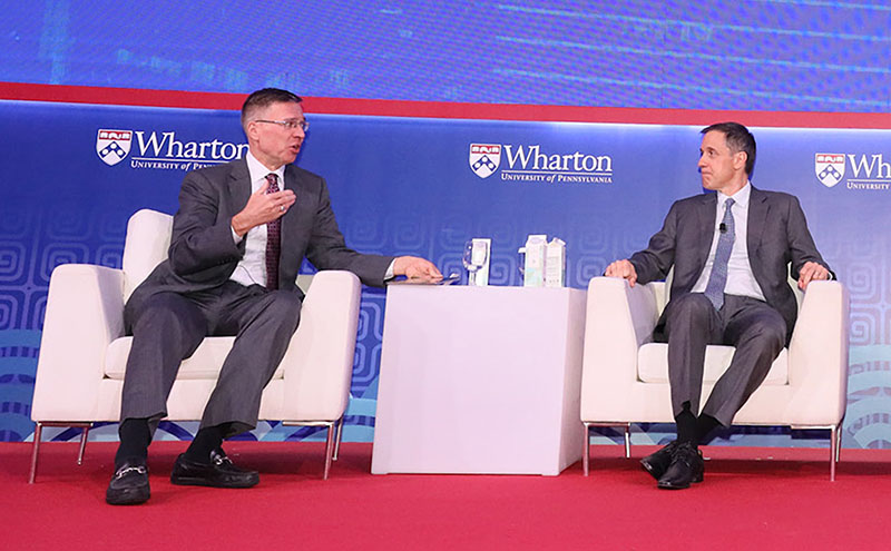Photo of Alp Ercil and Wharton Professor Witold Henisz at the Singapore Global Forum